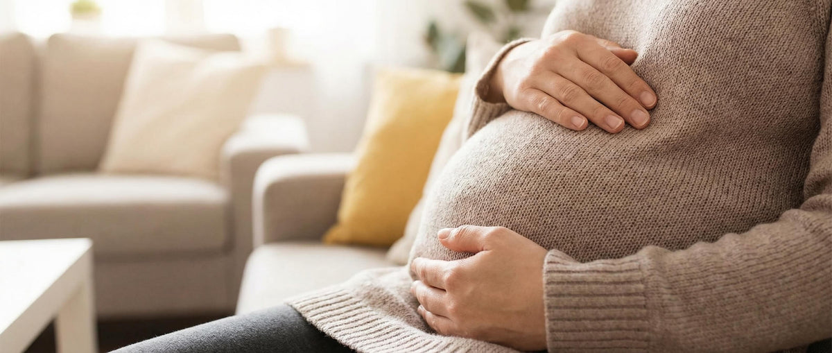 a pregnant woman holding her belly